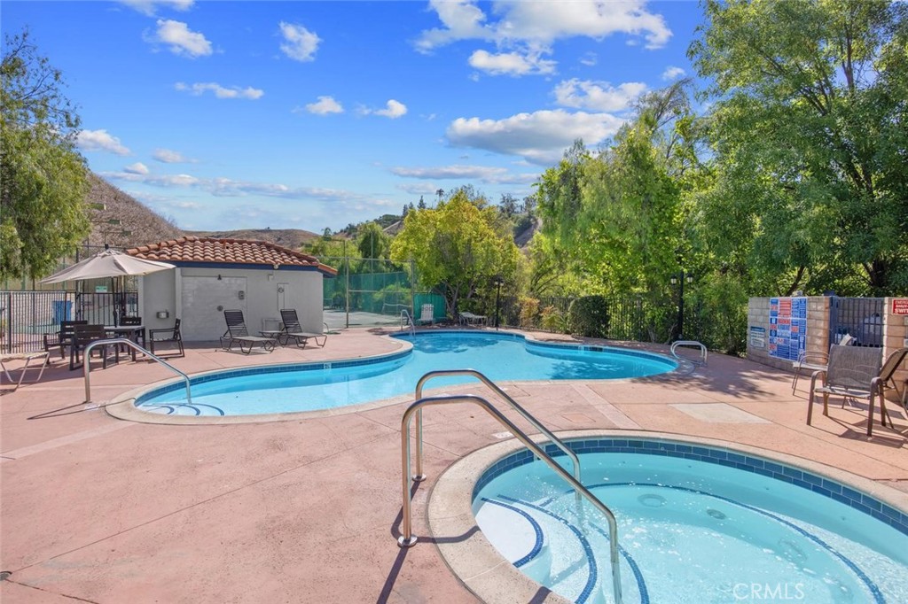 5974 Ruthwood Drive Calabasas, CA 91302 - Photo 26 of 30 a swimming pool with outdoor seating and yard