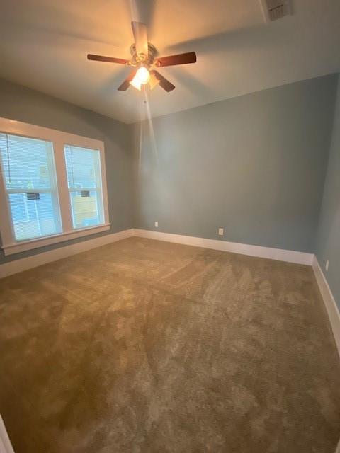 1715 East Pecan Street Sherman, TX 75090 - Photo 15 of 17 an empty room with windows and fan