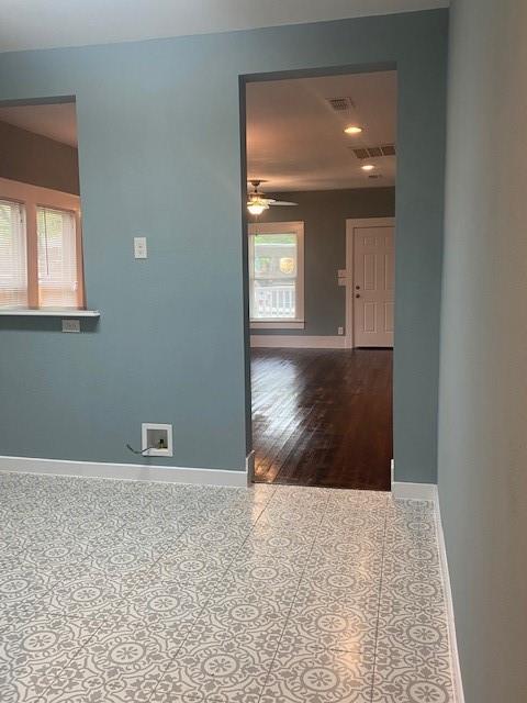 1715 East Pecan Street Sherman, TX 75090 - Photo 8 of 17 a view of a hallway with wooden floor and a window