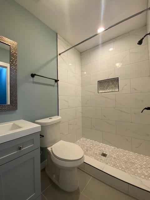 1715 East Pecan Street Sherman, TX 75090 - Photo 10 of 17 a bathroom with a sink a toilet and shower