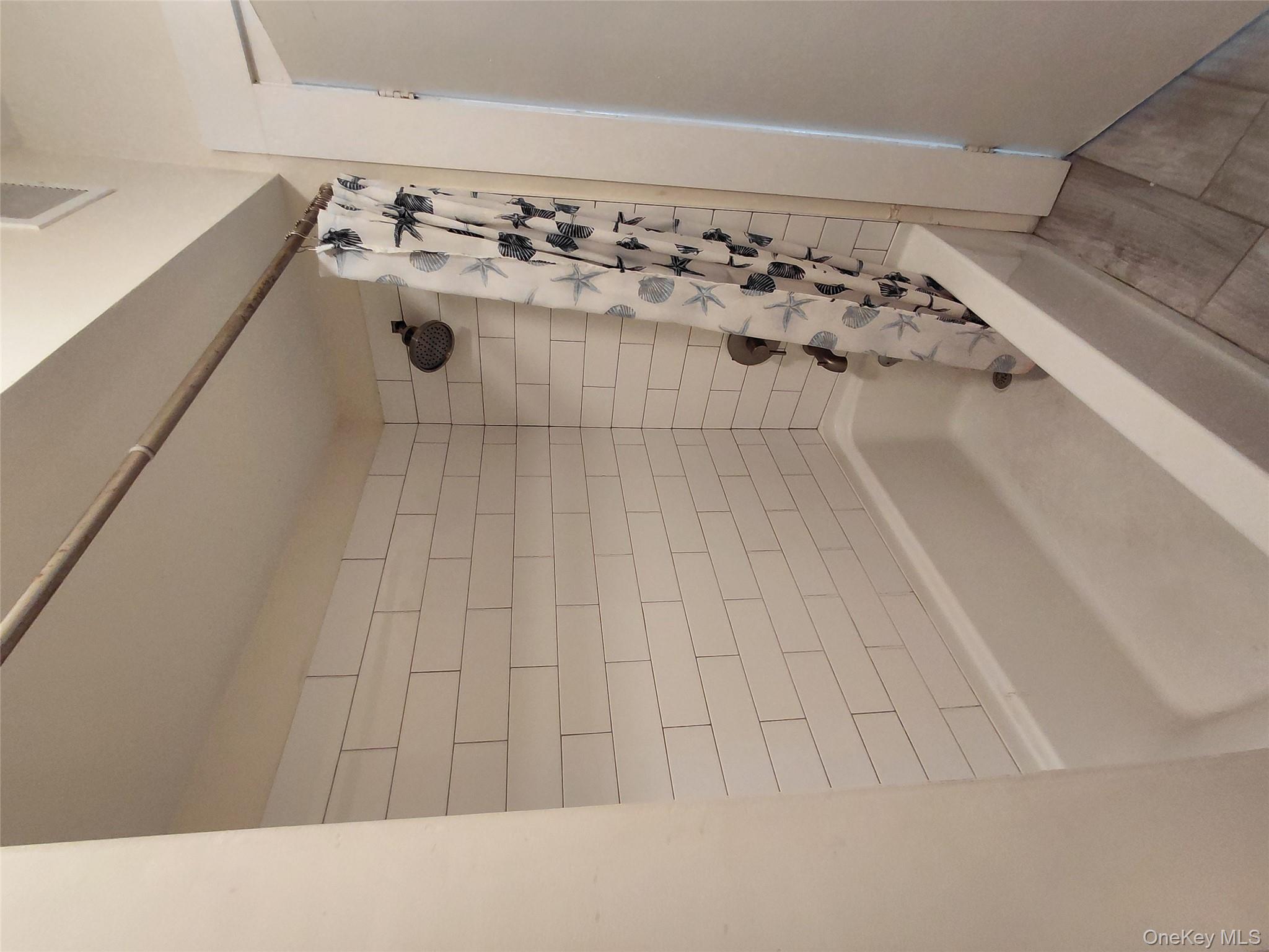 8 Center Street, Unit 1 Kingston, NY 12401 - Photo 12 of 13 a bathroom with a bathtub