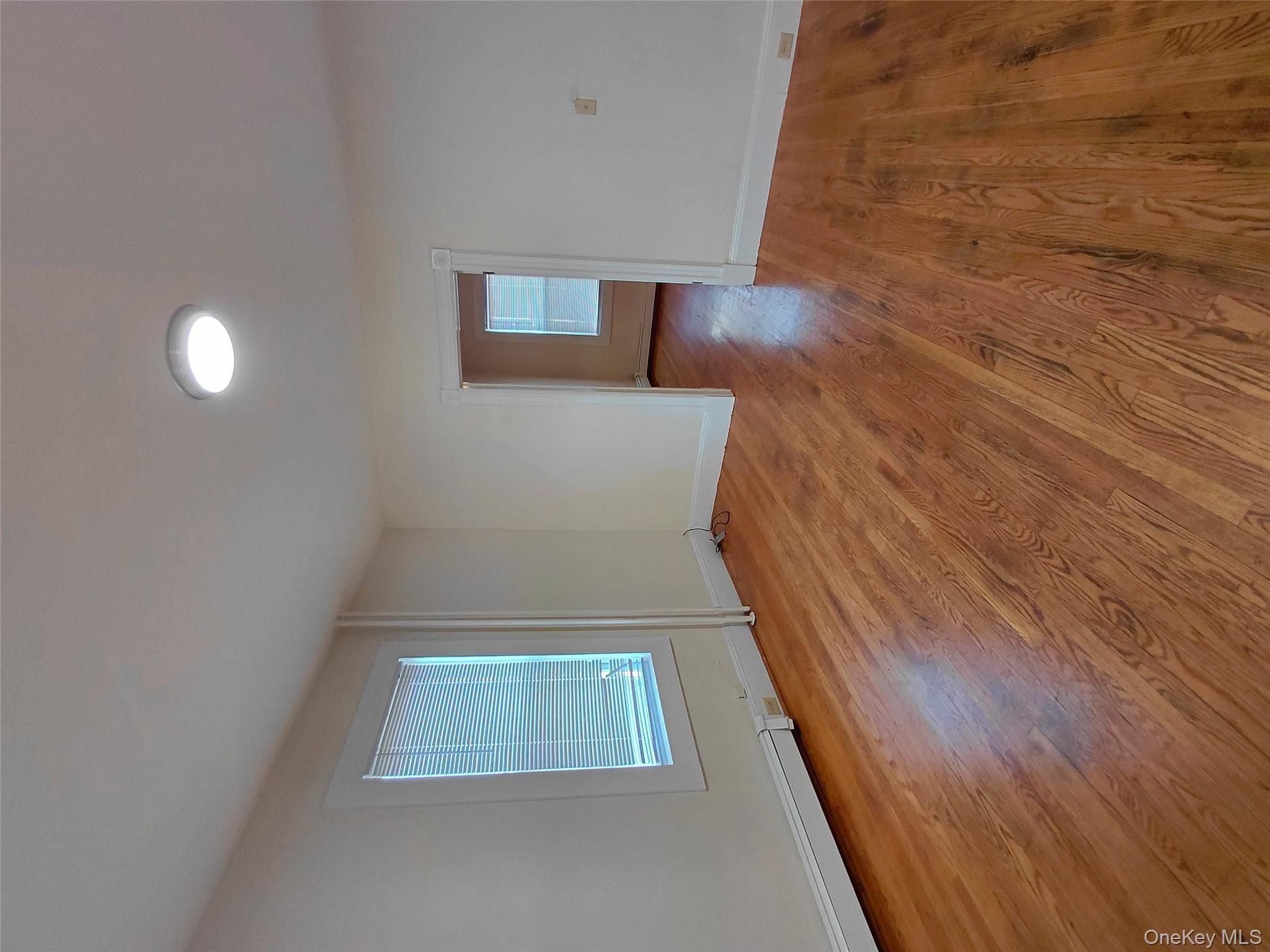 8 Center Street, Unit 1 Kingston, NY 12401 - Photo 5 of 13 a view of a room with wooden floor and window