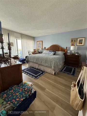 a bedroom with bed and window