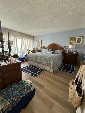 a bedroom with furniture and a window