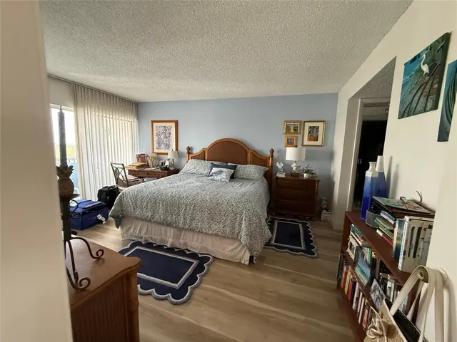 a bedroom with bed and tv