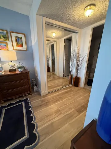 a room with wooden floor and furniture