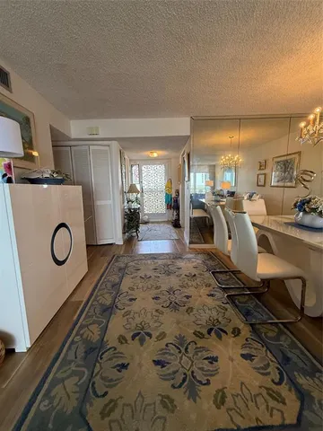 a view of a livingroom with furniture and a fireplace