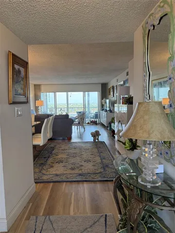 a view of a living room and kitchen