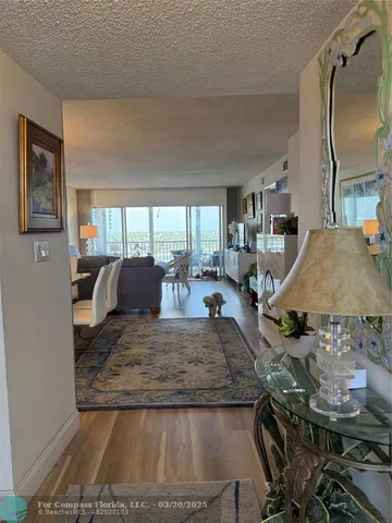 a view of a living room and kitchen