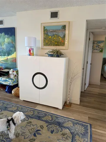 a view of kitchen with a sink and wooden floor