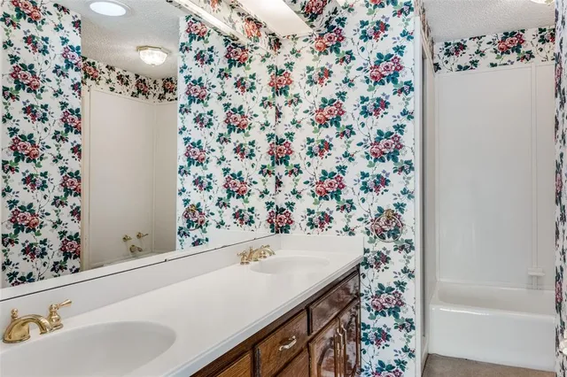 a bathroom with a sink and a bathtub