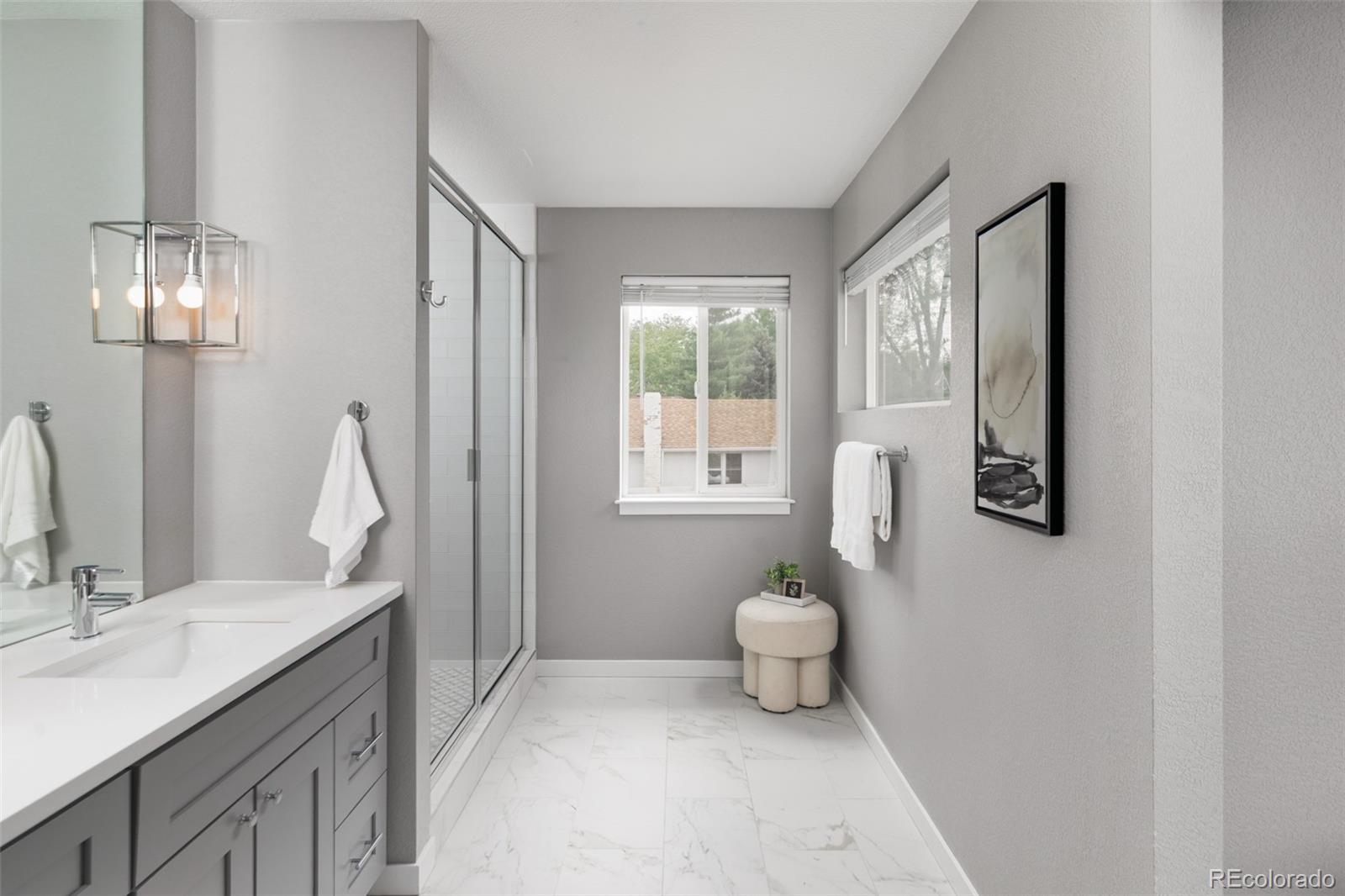 5230 Stuart Street Denver, CO 80212 - Photo 19 of 34 a bathroom with a sink toilet and a mirror