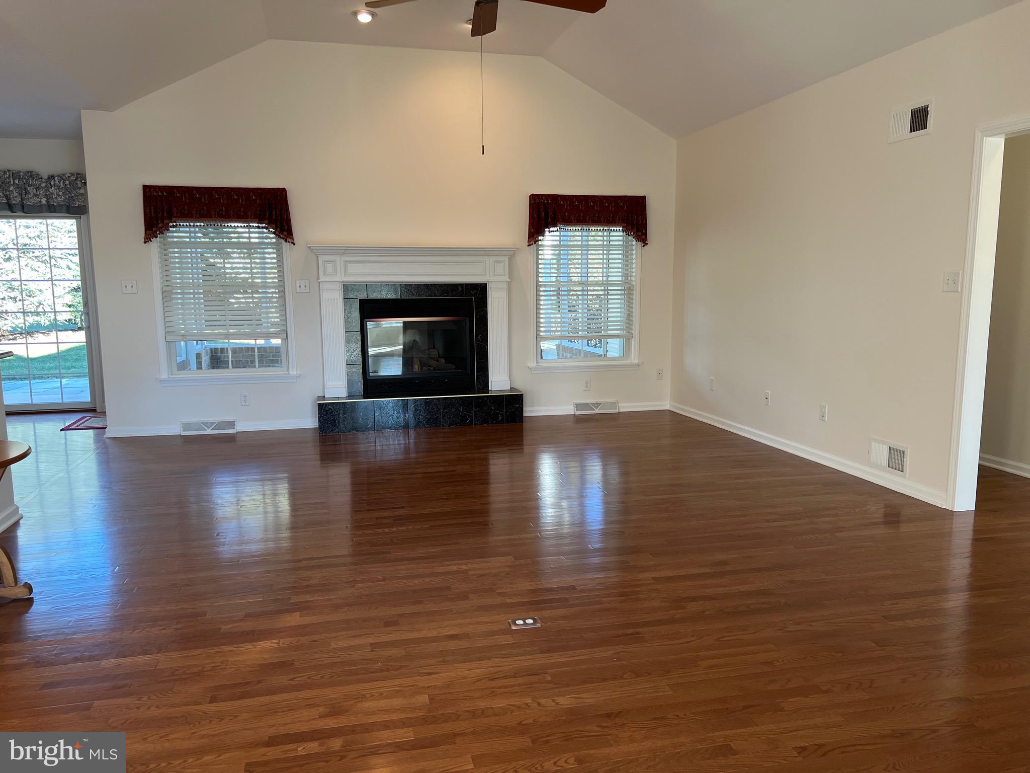 6337 Medina Ridge Drive Fayetteville, PA 17222 - Photo 13 of 50 a view of an empty room with window and wooden floor