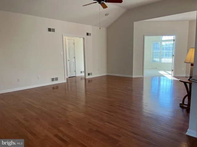 a kitchen with stainless steel appliances granite countertop a sink refrigerator and microwave