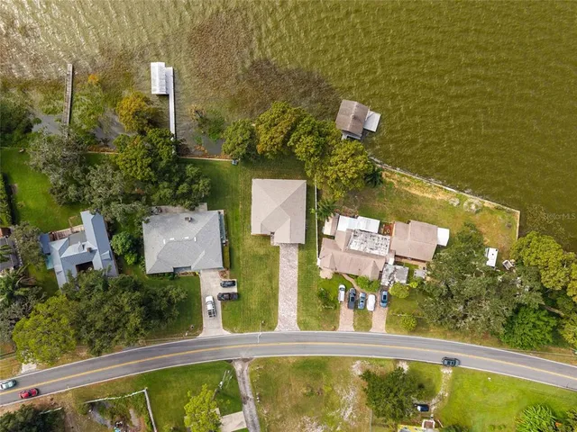 an aerial view of a house with swimming pool