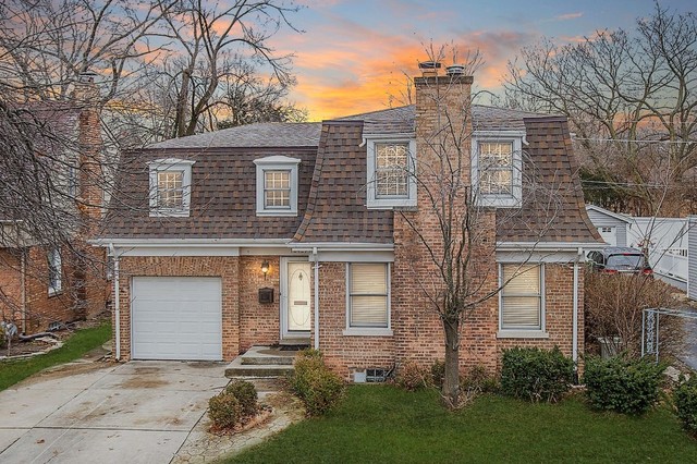 18427 Stewart Avenue Homewood, IL 60430 - Photo 1 of 13 front view of a house with a yard