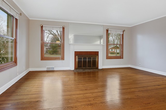 18427 Stewart Avenue Homewood, IL 60430 - Photo 2 of 13 a view of an empty room with window and wooden floor