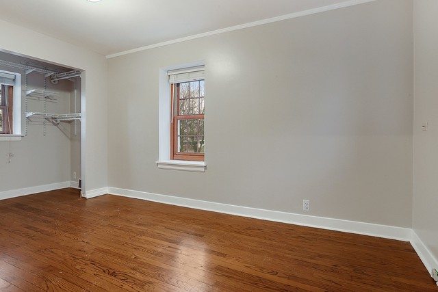 18427 Stewart Avenue Homewood, IL 60430 - Photo 11 of 13 a view of an empty room with wooden floor and a window