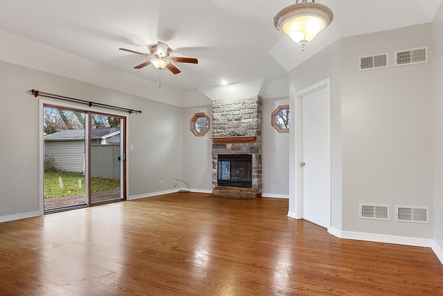 18427 Stewart Avenue Homewood, IL 60430 - Photo 6 of 13 a view of an empty room with wooden floor and a window