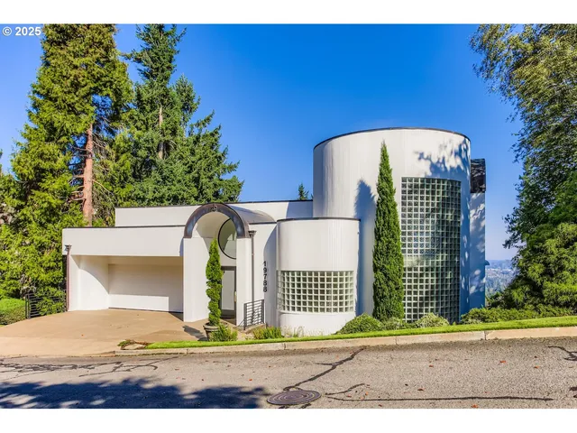 a view of a brick building next to a yard