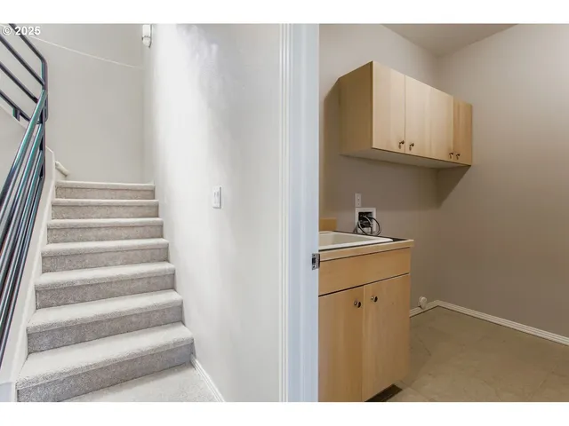 a kitchen with granite countertop cabinets and sink