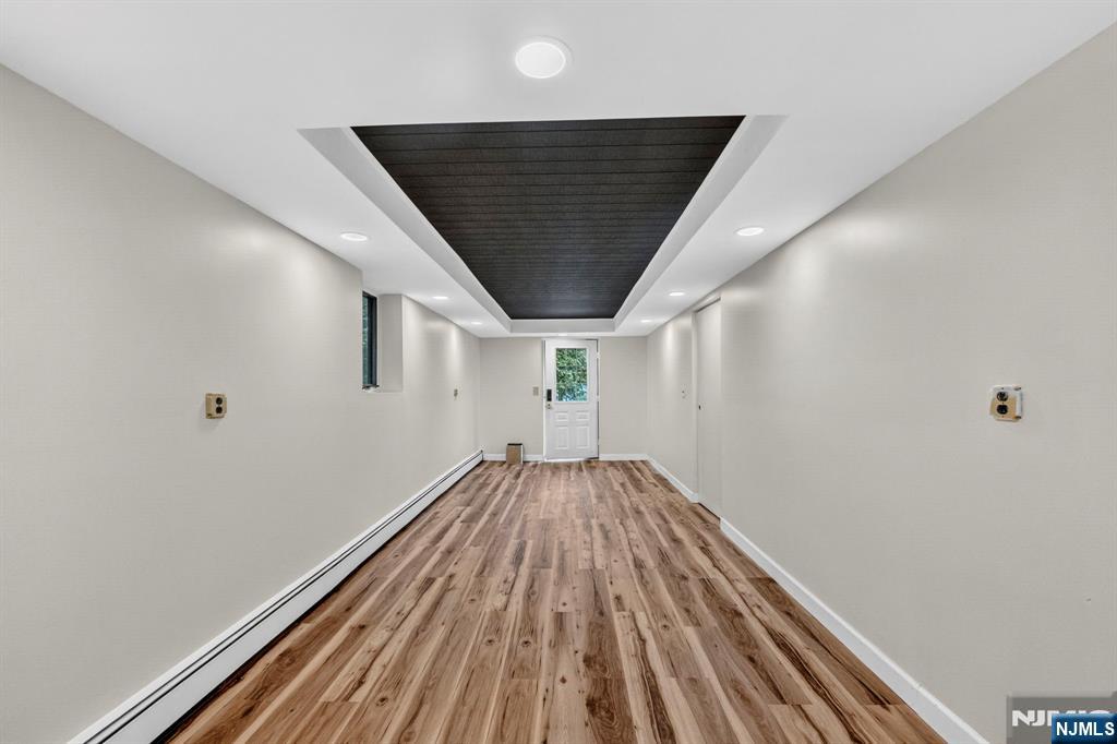 5110 Berkshire Valley Road Oak Ridge, NJ 07438 - Photo 42 of 49 a view of wooden floor in an empty room