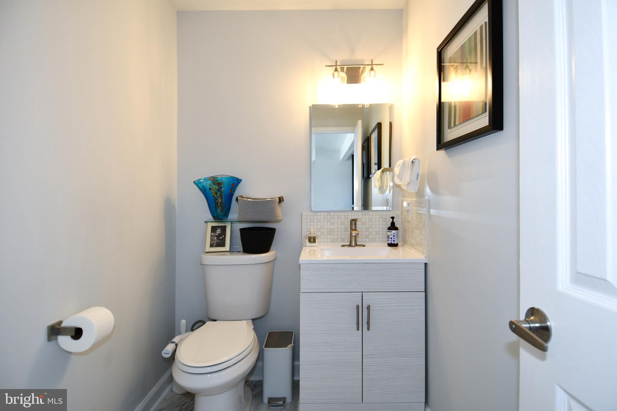 10188 Speedwell Court Manassas, VA 20110 - Photo 13 of 51 a bathroom with a toilet sink and mirror