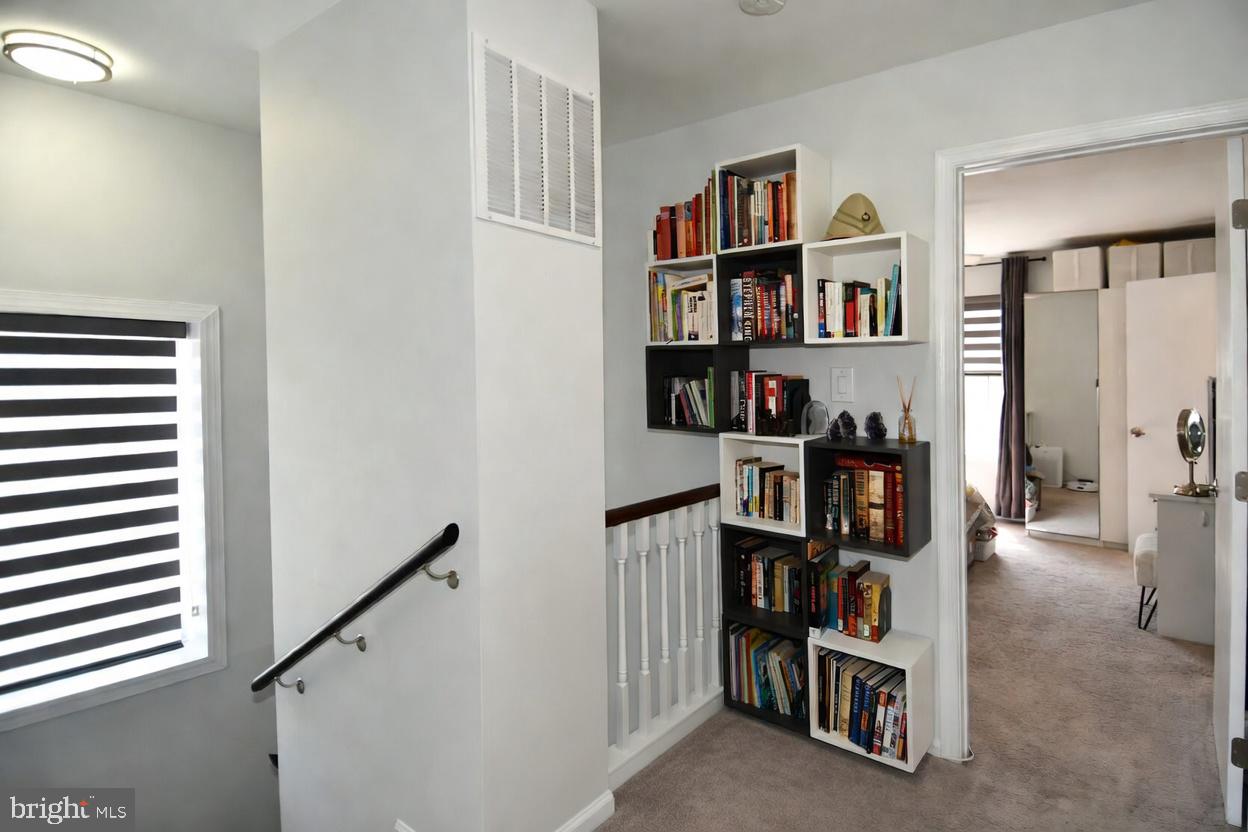 10188 Speedwell Court Manassas, VA 20110 - Photo 24 of 51 a view of a livingroom with shelves