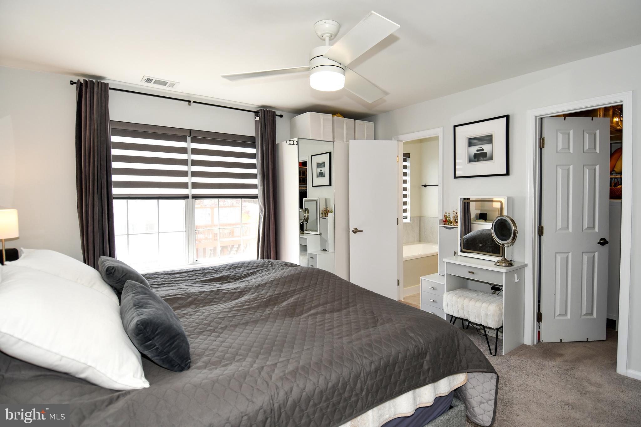 10188 Speedwell Court Manassas, VA 20110 - Photo 27 of 51 a bedroom with a bed and a tv on the dresser