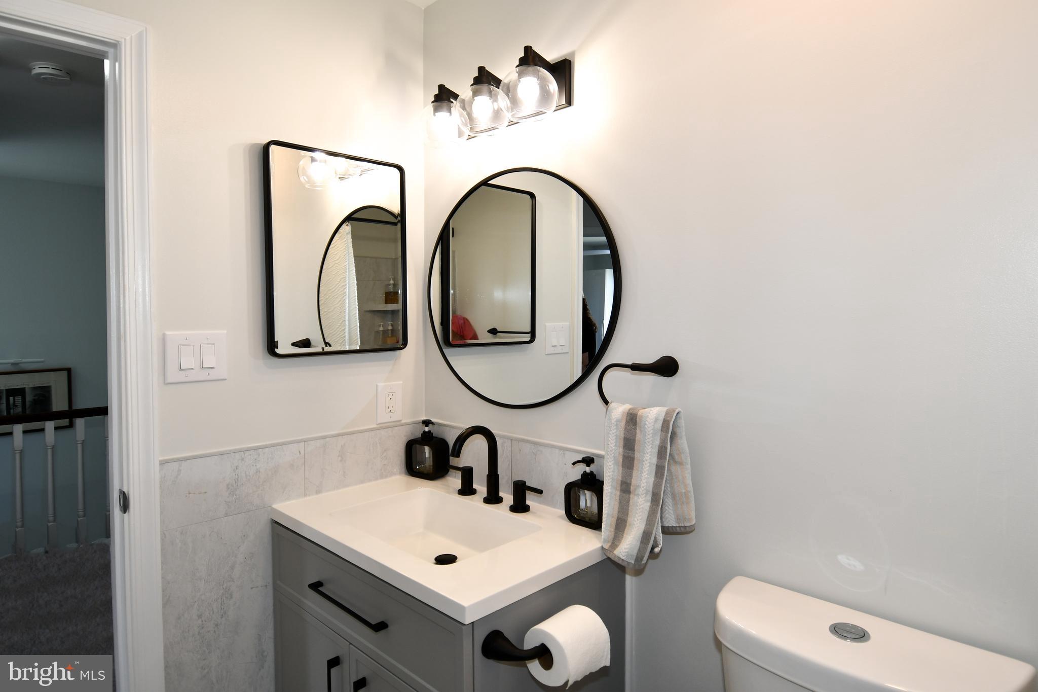 10188 Speedwell Court Manassas, VA 20110 - Photo 37 of 51 a bathroom with a sink and a mirror