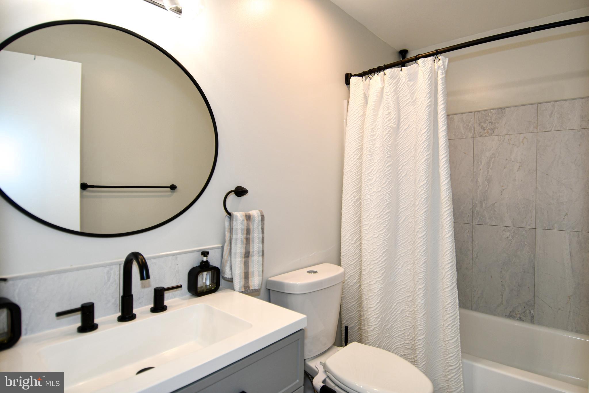 10188 Speedwell Court Manassas, VA 20110 - Photo 39 of 51 a bathroom with a sink and a mirror