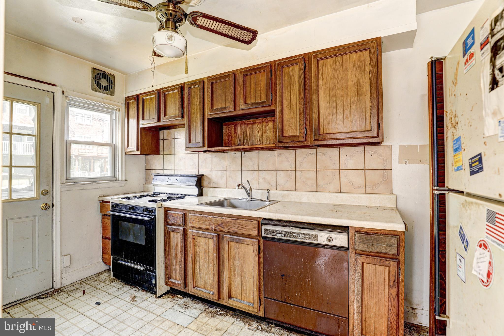 8656 Rock Oak Road Baltimore, MD 21234 - Photo 11 of 22 a kitchen with stainless steel appliances granite countertop a stove and a sink