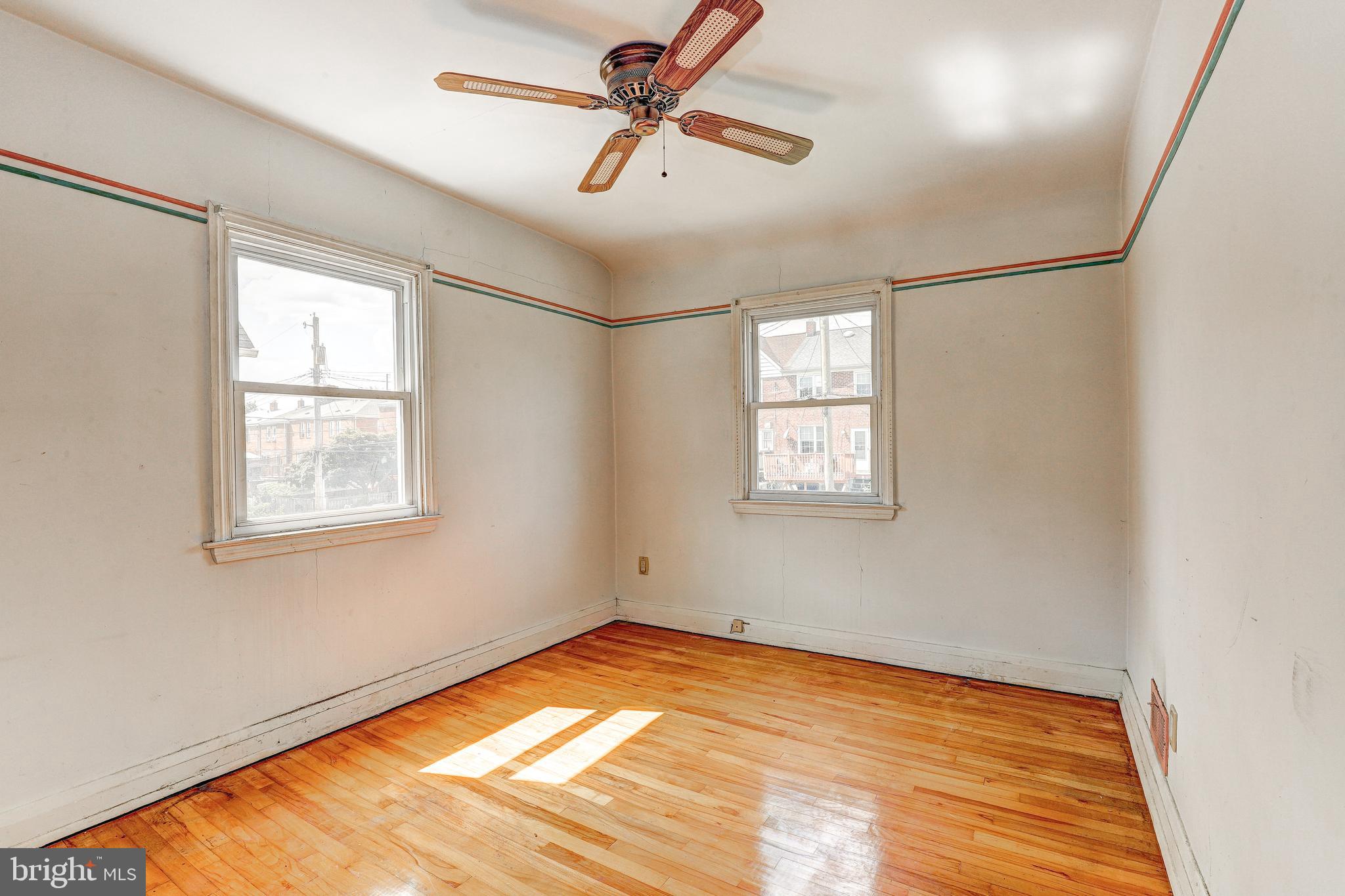 8656 Rock Oak Road Baltimore, MD 21234 - Photo 15 of 22 a view of empty room with window and ceiling fan
