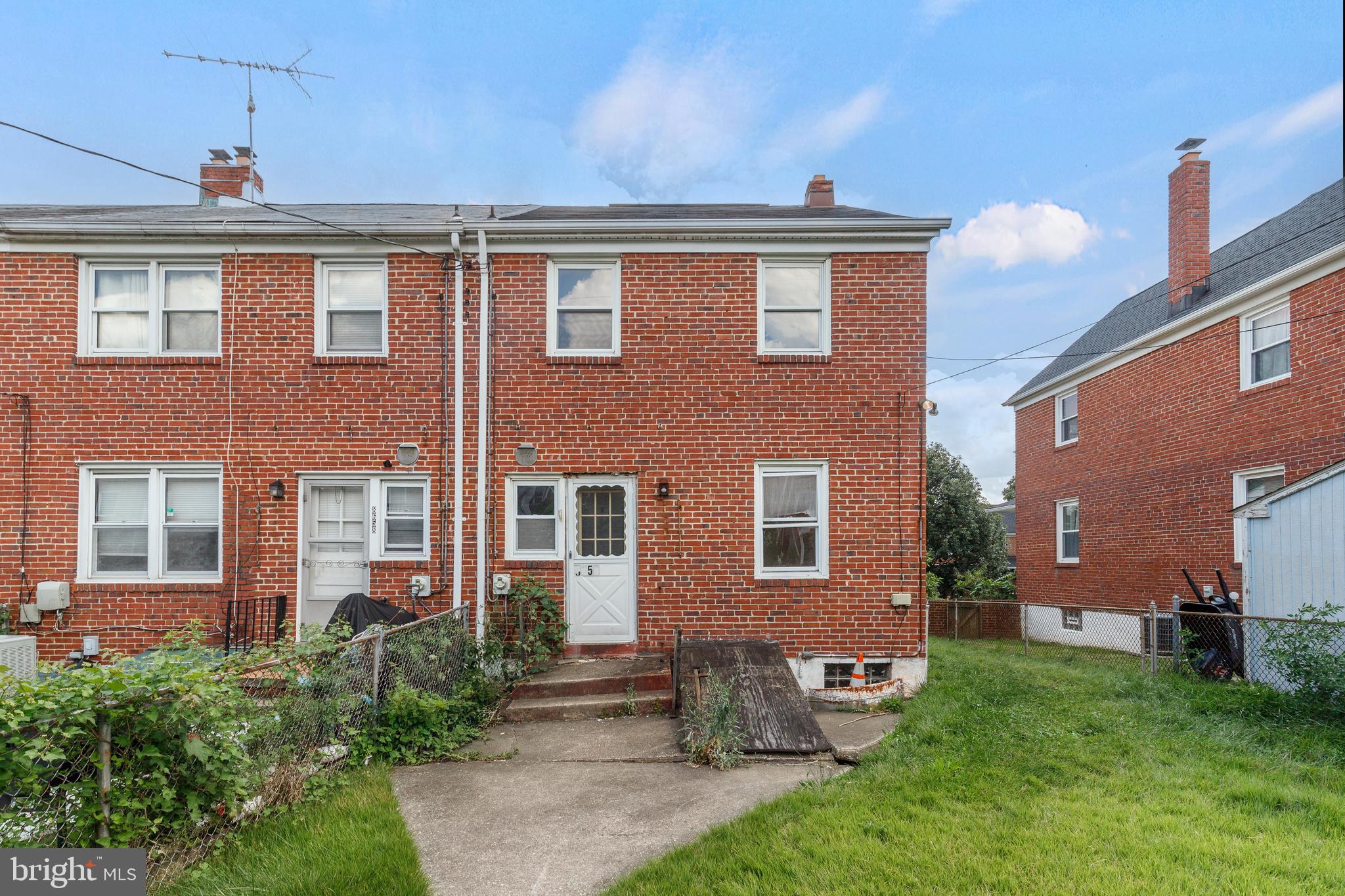 8656 Rock Oak Road Baltimore, MD 21234 - Photo 21 of 22 a front view of a house with garden