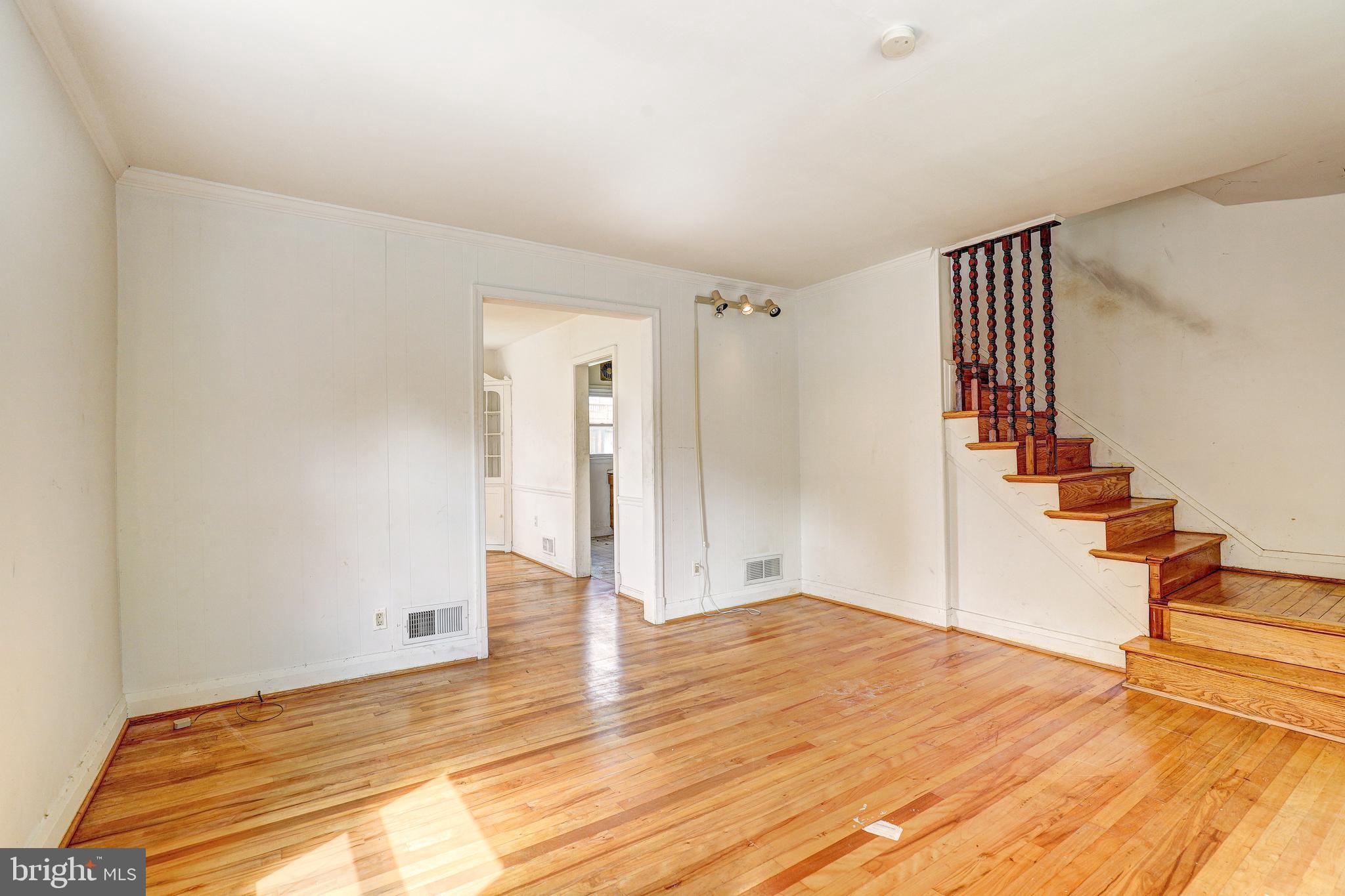 8656 Rock Oak Road Baltimore, MD 21234 - Photo 8 of 22 a big room with wooden floor and entryway