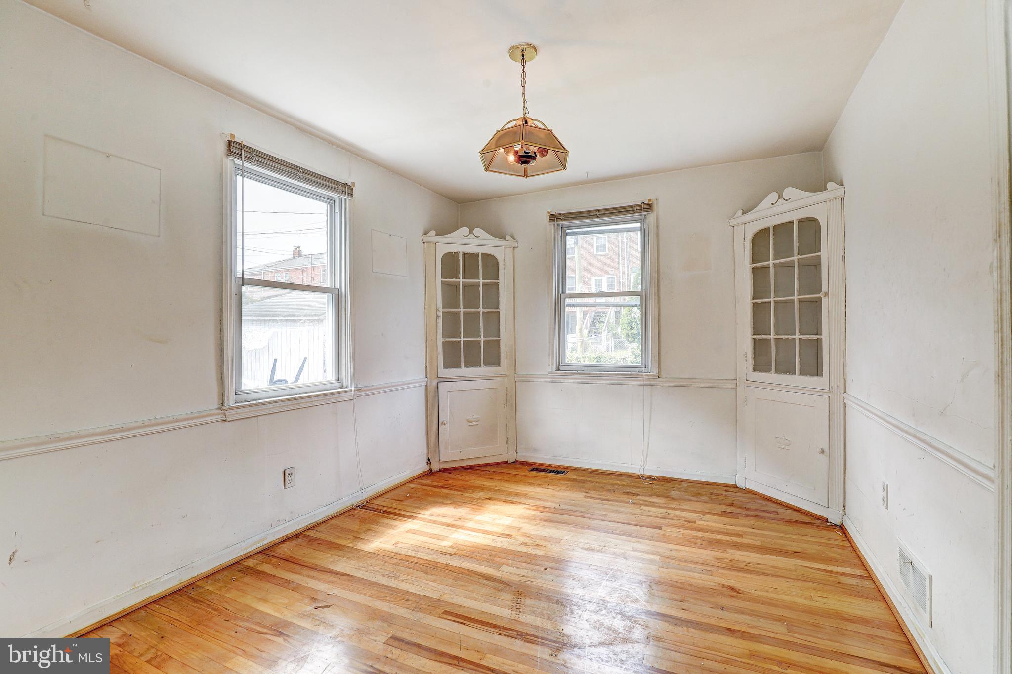 8656 Rock Oak Road Baltimore, MD 21234 - Photo 9 of 22 a view of empty room with wooden floor and fan
