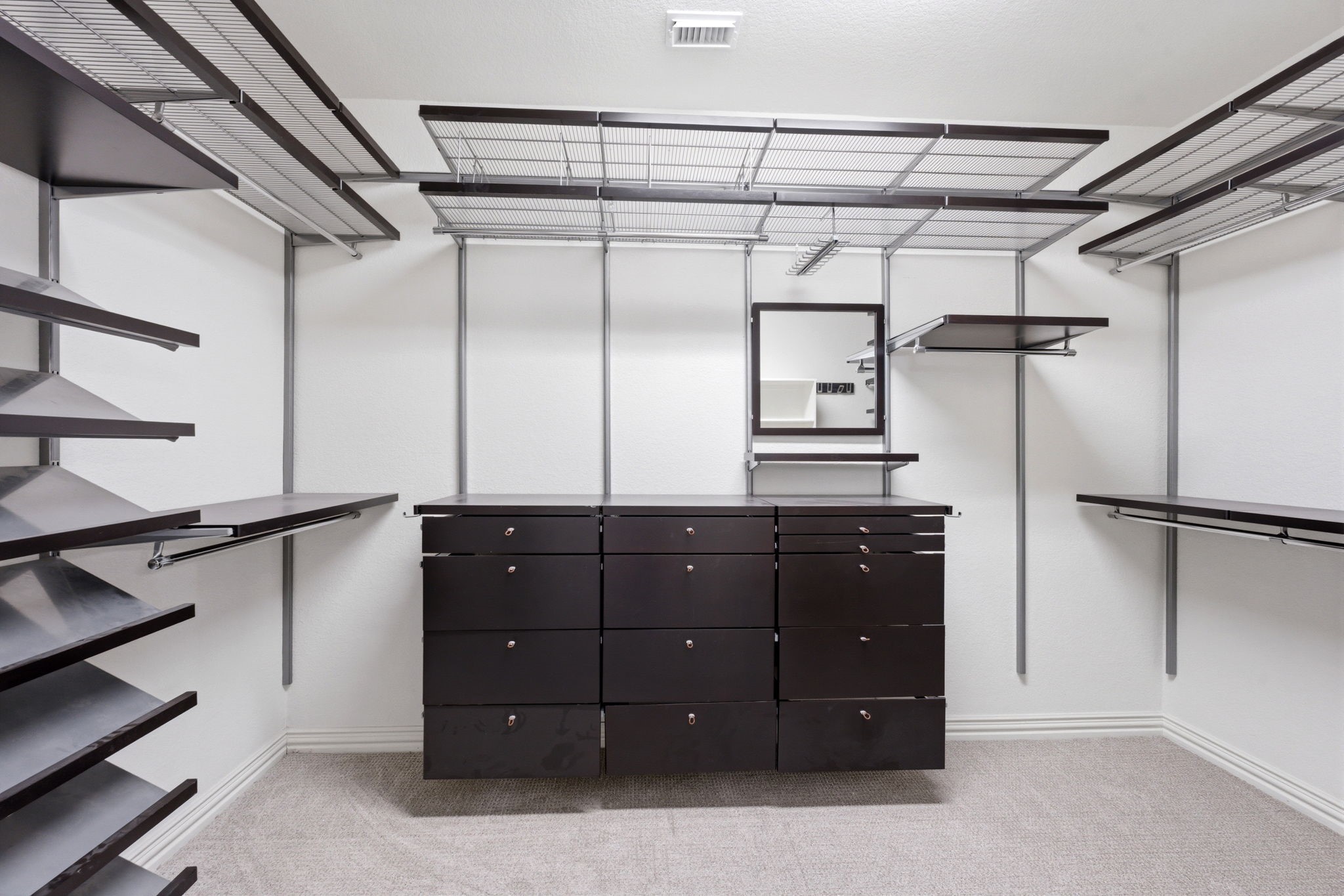 315 Arbor Ridge Lane Conroe, TX 77384 - Photo 23 of 48 The primary closet with custom shelving is a showstopper!!