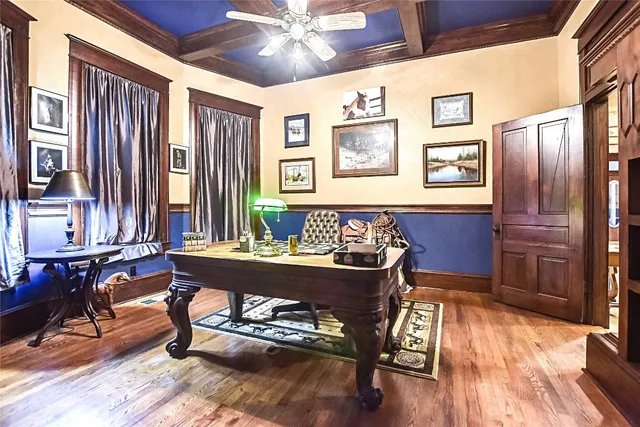 a dining room with furniture and wooden floor