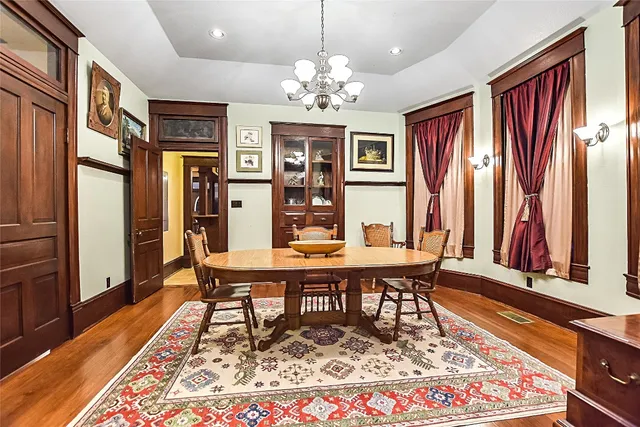 a living room with furniture rug and a window