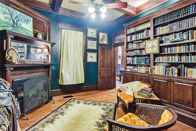 a bed room with furniture and a ceiling fan