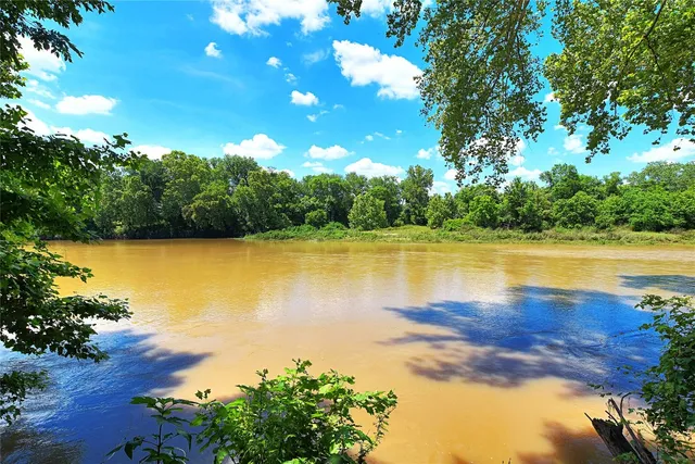 a view of a playground with basketball court