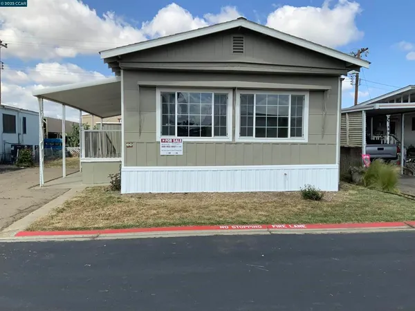 a house with trees in the background