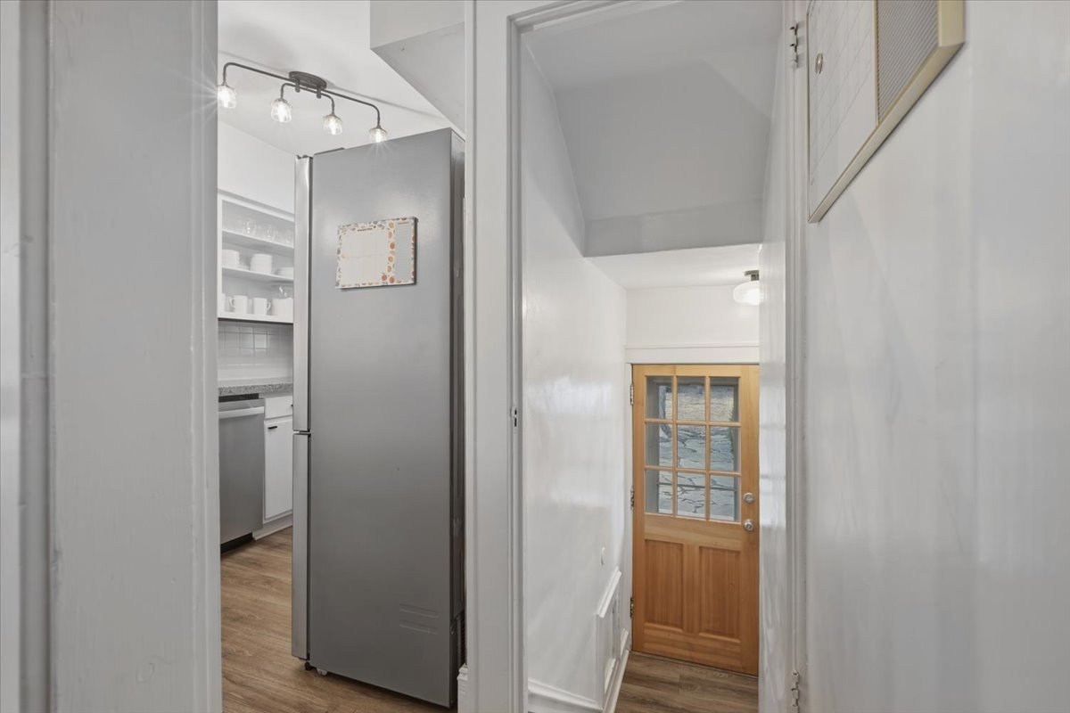 611 Vale Street Bloomington, IL 61701 - Photo 19 of 36 a view of a hallway with wooden floor and closet