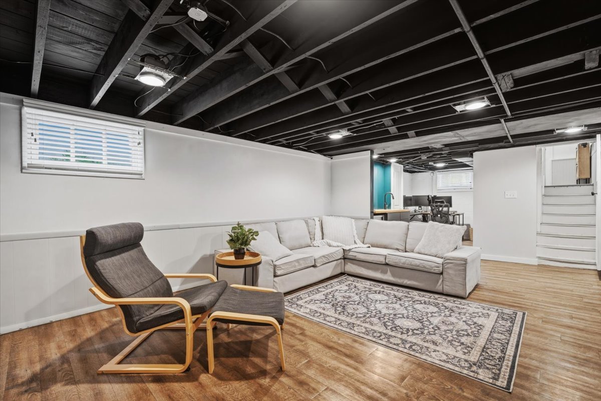 611 Vale Street Bloomington, IL 61701 - Photo 21 of 36 a living room with a couch wooden floor and a table