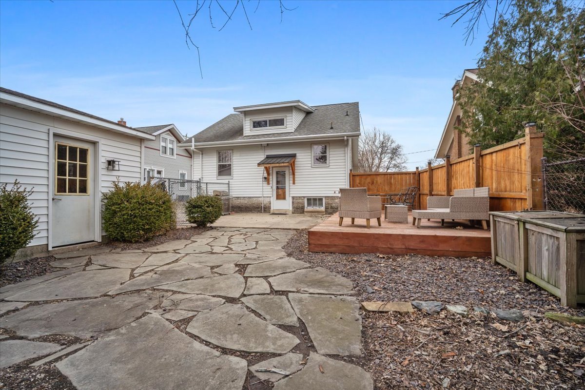 611 Vale Street Bloomington, IL 61701 - Photo 35 of 36 a view of a white house with a yard in the background