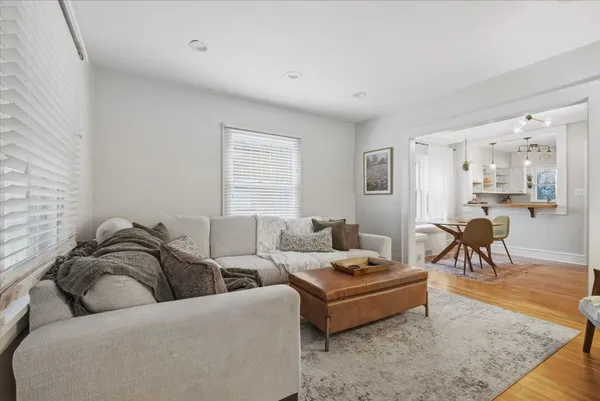 a living room with furniture and a rug