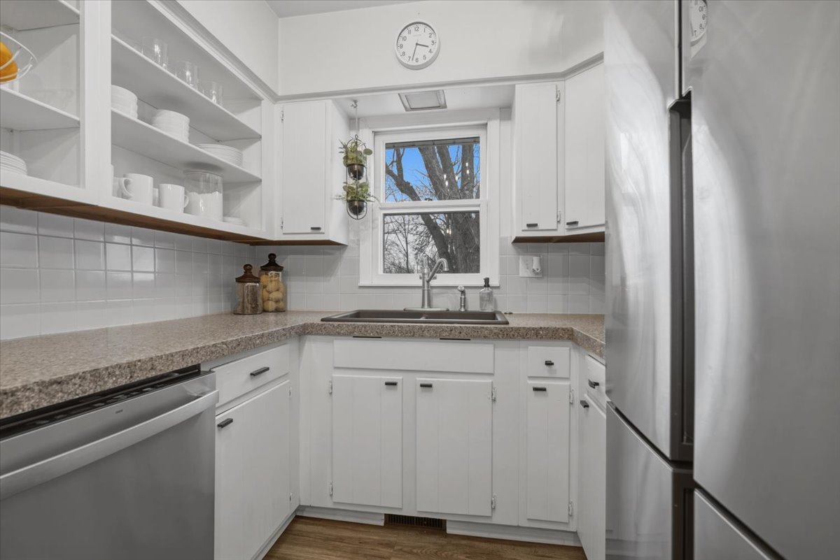611 Vale Street Bloomington, IL 61701 - Photo 9 of 36 a kitchen with granite countertop a sink and cabinets