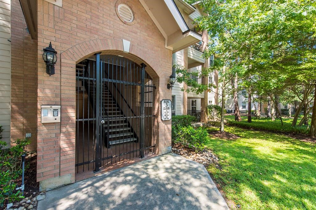 8051 Bay Branch Drive, Unit 312 The Woodlands, TX 77382 - Photo 3 of 22 a view of a entrance of building