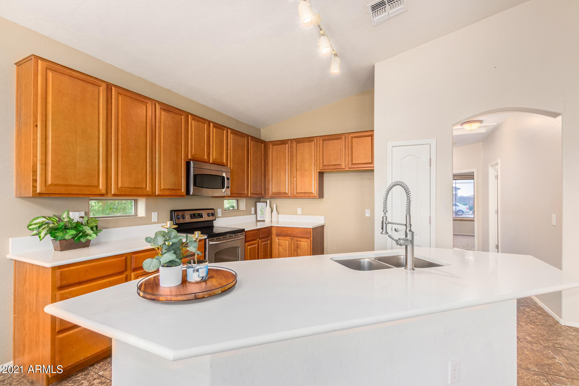 10070 East Hay Loft Road Florence, AZ 85132 - Photo 7 of 29 Kitchen with Island and Seating