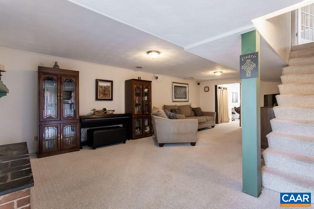 2938 Milton Road Charlottesville, VA 22902 - Photo 16 of 44 a living room with furniture and a flat screen tv